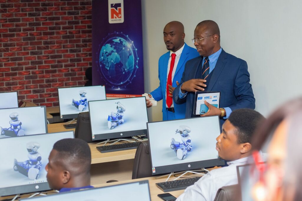 Ambrose Yennah, Executive Chairman of AIDEC Digital, right, inspecting the AIDEC AI Centre of Excellence