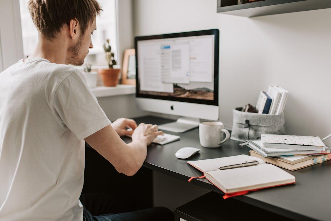 Free Photo Of Man Using Computer Stock Photo