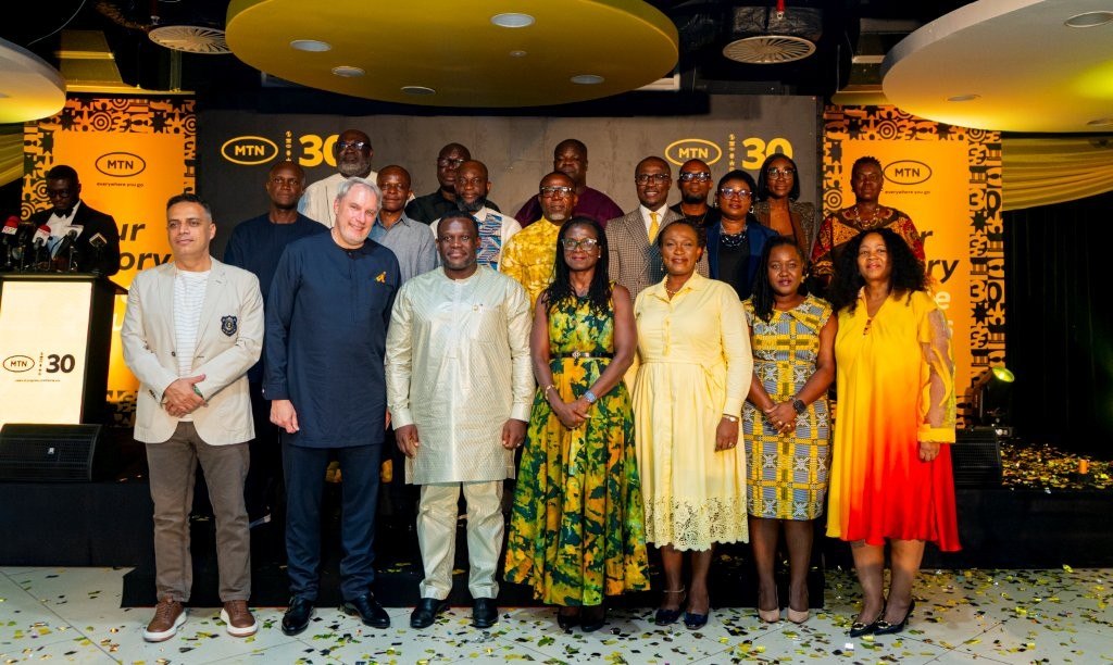 MTN Ghana ExCom in a group photograph with the Minister for Communications, Digital Technology and Innovation.