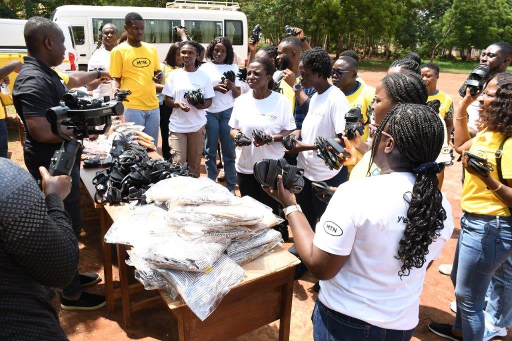 MTN GHANA EMPLOYEE VOLUNTEERS TO EQUIP HEALTH CENTERS AS PART OF ITS 2026 21 DAYS OF Y’ELLO CARE CAMPAIGN 5 MTN Staff Volunteers ready to distribute shoes and school uniforms they made during the 2025 Y'ello Care to students of Ad...